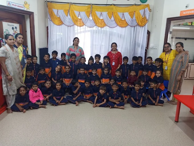 Students and teachers group photo indoors