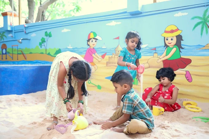 Kids playing with sand and toys outdoors