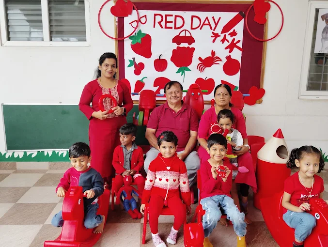 Families celebrating Red Day with children