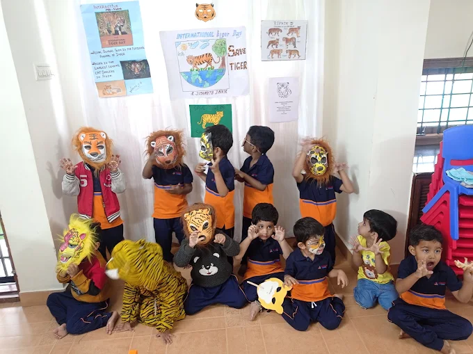 Kids wearing animal masks for Tiger Day activity