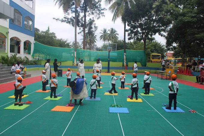 Children in helmets lined up for sports event
