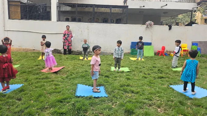 Kids doing outdoor exercise on mats