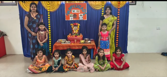 Children celebrating Ugadi festival with teachers
